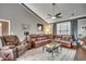 Comfortable living room with a leather sectional, a ceiling fan, and plenty of space for relaxation at 4382 Saint Annes Ct., Myrtle Beach, SC 29579