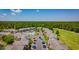 Aerial view of the neighborhood featuring a community pool, plenty of parking, and bordering a golf course at 4657 Fringetree Dr. # C, Murrells Inlet, SC 29576