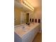 Bright bathroom featuring double vanity sinks, granite counters, and neutral walls at 4657 Fringetree Dr. # C, Murrells Inlet, SC 29576