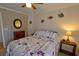 Cozy bedroom with ceiling fan, queen bed with floral bedding, and wood furnishings at 4657 Fringetree Dr. # C, Murrells Inlet, SC 29576