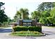 Community entrance sign surrounded by colorful flowers and manicured landscaping at 4657 Fringetree Dr. # C, Murrells Inlet, SC 29576