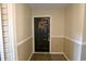 Inviting entryway featuring a welcoming black front door with wreath and a patterned welcome mat at 4657 Fringetree Dr. # C, Murrells Inlet, SC 29576