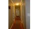 Bright hallway with hardwood floors, neutral walls, and white doors at 4657 Fringetree Dr. # C, Murrells Inlet, SC 29576