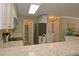Bright kitchen featuring white cabinets, stainless steel appliances, marble countertops, and a stainless refrigerator at 4657 Fringetree Dr. # C, Murrells Inlet, SC 29576
