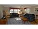 Comfortable living room with hardwood floors, ample natural light, two sofas, and a ceiling fan at 4657 Fringetree Dr. # C, Murrells Inlet, SC 29576