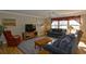 Inviting living room with hardwood floors, lots of natural light, sofas, and a TV at 4657 Fringetree Dr. # C, Murrells Inlet, SC 29576
