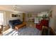 Cozy living room with hardwood floors, comfortable seating, and an open layout connecting to the kitchen and dining area at 4657 Fringetree Dr. # C, Murrells Inlet, SC 29576