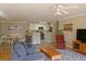 Inviting living room with eat in kitchen, ceiling fan, and light color walls at 4657 Fringetree Dr. # C, Murrells Inlet, SC 29576