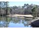 Scenic view of a pond reflecting trees, with a golf course in the background at 4657 Fringetree Dr. # C, Murrells Inlet, SC 29576