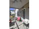 Charming screened-in porch with tiled floor and partial view of the neighborhood at 4657 Fringetree Dr. # C, Murrells Inlet, SC 29576