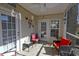 Outdoor living with patio furniture on a screened-in porch with tile floor at 4657 Fringetree Dr. # C, Murrells Inlet, SC 29576