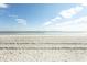 Expansive sandy beach with clear blue sky at 5801 Oyster Catcher Dr. # 1624, North Myrtle Beach, SC 29582