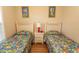Well-lit bedroom featuring two twin beds and a shared nightstand at 5801 Oyster Catcher Dr. # 1624, North Myrtle Beach, SC 29582
