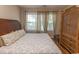 King-size bedroom with large windows, dresser, and wardrobe at 5801 Oyster Catcher Dr. # 1624, North Myrtle Beach, SC 29582