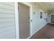 Condo building entrance with a modern door and security system at 5801 Oyster Catcher Dr. # 1624, North Myrtle Beach, SC 29582