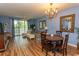 Elegant dining area with hardwood floors and a charming chandelier at 5801 Oyster Catcher Dr. # 1624, North Myrtle Beach, SC 29582