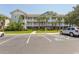 Two-story condo building with balconies and ample parking at 5801 Oyster Catcher Dr. # 1624, North Myrtle Beach, SC 29582