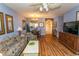 Open living room showcasing hardwood floors, comfortable seating, and a dining area at 5801 Oyster Catcher Dr. # 1624, North Myrtle Beach, SC 29582