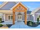 Front entrance with a wood covered porch and double doors at 6228 Highway 65, Conway, SC 29526