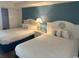 Bedroom with two double beds and nightstand at 6804 N Ocean Blvd. # 1527, Myrtle Beach, SC 29572