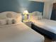 Two double beds in a bright bedroom with nightstands at 6804 N Ocean Blvd. # 1527, Myrtle Beach, SC 29572