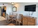 Small dining area with table and chairs, kitchen access at 6804 N Ocean Blvd. # 1527, Myrtle Beach, SC 29572