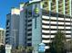 Multi-story building with parking and signage at 6804 N Ocean Blvd. # 1527, Myrtle Beach, SC 29572