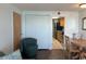 Living room with chair and kitchen access at 6804 N Ocean Blvd. # 1527, Myrtle Beach, SC 29572