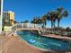Lazy river style pool with bridge and lounge chairs at 6804 N Ocean Blvd. # 1527, Myrtle Beach, SC 29572