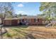 Brick house exterior with a large backyard and shed at 708 Britt St., Georgetown, SC 29440