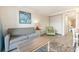 Living room with gray couch and wood coffee table at 7200 N Ocean Blvd. # 765, Myrtle Beach, SC 29572