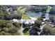 Aerial view of country club with clubhouse, golf course, and pond at 786 Savannah Dr., Pawleys Island, SC 29585