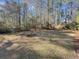 Large backyard with lush green grass and trees at 786 Savannah Dr., Pawleys Island, SC 29585