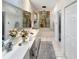 Elegant bathroom with double vanity, large bathtub, and decorative mural at 786 Savannah Dr., Pawleys Island, SC 29585