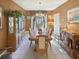 Formal dining room featuring a large wooden table, chandelier, and built-in hutch at 786 Savannah Dr., Pawleys Island, SC 29585