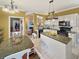 Eat-in kitchen with granite counters, island, and white cabinets at 786 Savannah Dr., Pawleys Island, SC 29585
