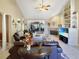 Spacious living room with high ceilings, a fireplace, and lots of natural light at 786 Savannah Dr., Pawleys Island, SC 29585