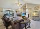 Spacious living room with high ceilings, fireplace, and access to a sunroom at 786 Savannah Dr., Pawleys Island, SC 29585