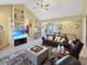 Open living area with high ceilings, leather furniture, and a large TV at 786 Savannah Dr., Pawleys Island, SC 29585