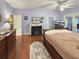 Main bedroom with fireplace, large bed, and access to deck at 786 Savannah Dr., Pawleys Island, SC 29585