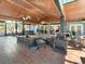 Large screened porch with ample seating, a bar, and grilling area at 786 Savannah Dr., Pawleys Island, SC 29585