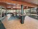 Extended screened porch with a tiled floor and outdoor seating at 786 Savannah Dr., Pawleys Island, SC 29585