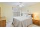 Guest bedroom features a ceiling fan and large window with blinds at 820 Fairway Dr. # 1605, Longs, SC 29568