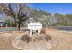 Welcome sign to Colonial Creek Golf Resorts surrounded by landscaping at 820 Fairway Dr. # 1605, Longs, SC 29568