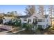 Well-maintained condo building with palm trees, green stairways, and white wooden siding at 820 Fairway Dr. # 1605, Longs, SC 29568