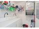 Functional laundry area with washer, dryer, shelving and utilities at 820 Fairway Dr. # 1605, Longs, SC 29568