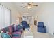 Cozy living room with plush seating, a glass coffee table, and an open view to the kitchen at 820 Fairway Dr. # 1605, Longs, SC 29568