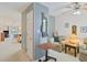 Sitting area with striped wallpaper, side table, mirror, and view of kitchen at 820 Fairway Dr. # 1605, Longs, SC 29568