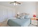 Spacious main bedroom with ceiling fan, side tables and lamps at 820 Fairway Dr. # 1605, Longs, SC 29568