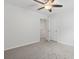 Bedroom with ceiling fan and access to hallway at 878 Snowberry Dr., Longs, SC 29568